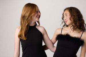 Two girls in black dresses.