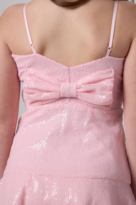 Sequin bow back tiered dress in pink.