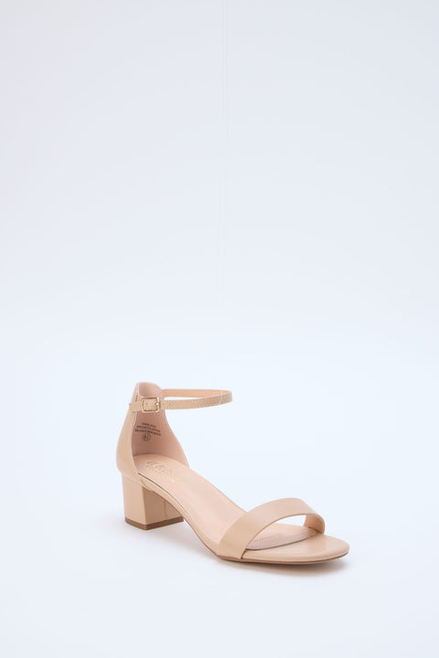 Beige sandal with a block heel on a light gray background