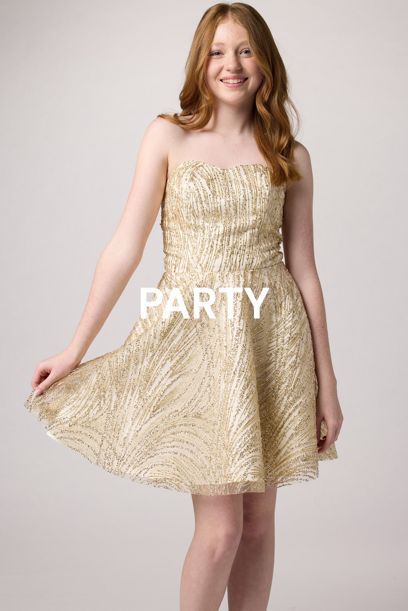 Red head in a gold sequin dress.