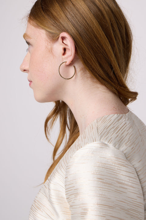 Girl wearing an earring hoop