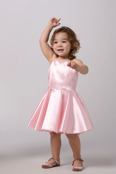 Little girl in a pink dress.