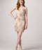 Red head in a blush pink beaded lace up back dress with nude heel.
