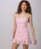 Brunette in a pink sequin dress.