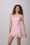 Brunette in a pink sequin dress.