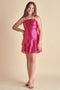 Sequin bow back tiered dress in pink.