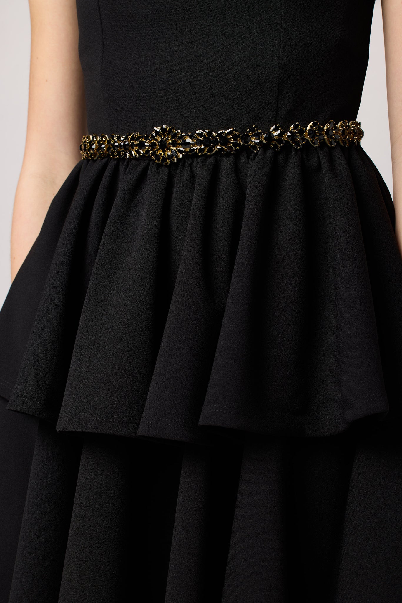 Black tired dress with belt.