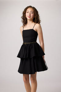 Black tired dress with belt.