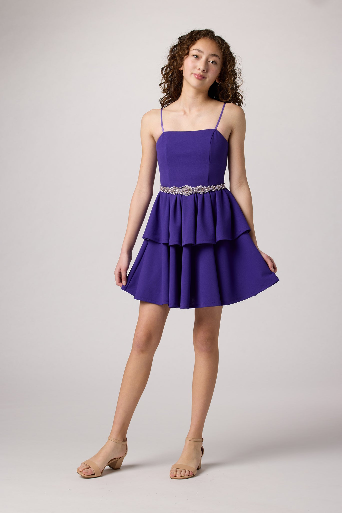 Purple tired dress with belt.