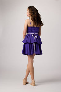 Purple tired dress with belt.