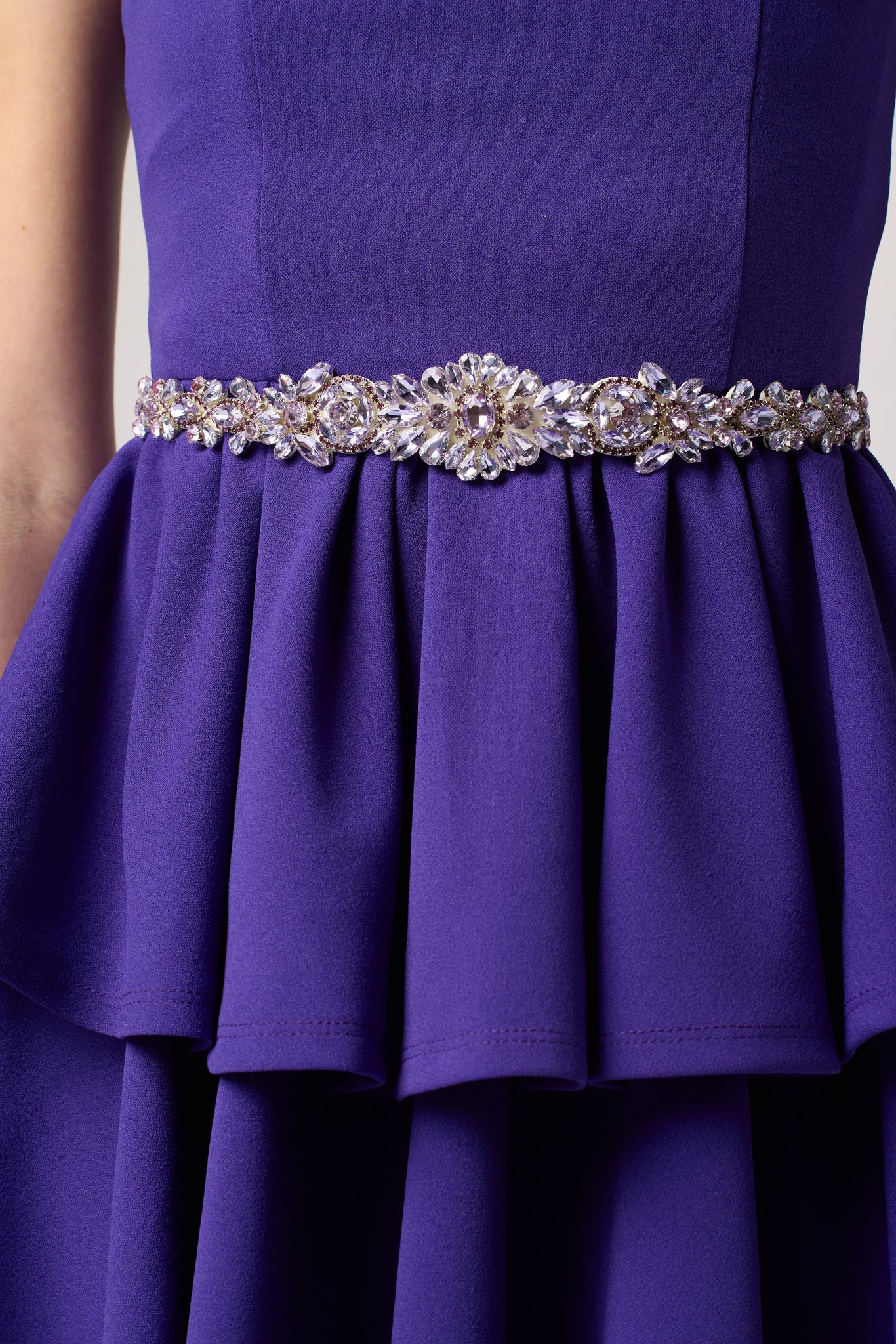 Purple tired dress with belt.