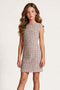 A young girl with long wavy brown hair wearing a textured burgundy and ivory sleeveless fit-and-flare dress, standing against a light gray textured studio background.