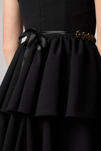 Black tired dress with belt.