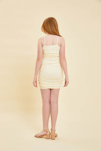 Red head girl wearing a cream fitted mesh dress.Red head girl wearing a cream fitted mesh dress.
