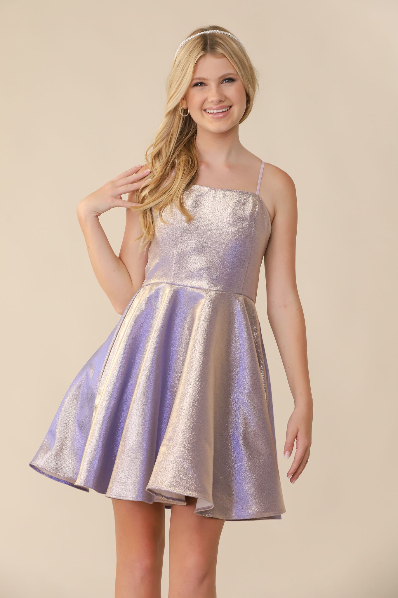 This is an all over soft, lilac glitter jacquard dress with high waist line, zipper back, and adjustable straps for comfort. Hits above the knee and is a perfect dress for any special occasion.
