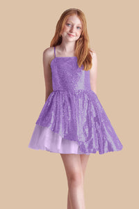 Red haired girl in a lilac sequin and tulle dress.