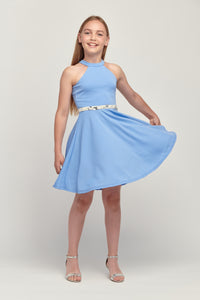 Halter dress in denim features a full circle twirl skirt, open hole detailing in back and high waist line for a chic silhouette. Can be styled with belt sold separately. 