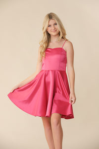 This is an all over, non-stretch satin fabric dress in fuchsia pink. Hits right above the knee for a chic and sophisticated look. It features adjustable straps and full circle skirt.