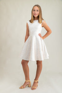 This is an all over jacquard, cap sleeve dress in ivory with non-stretch material, zipper back, and longer length detailing. This dress is perfect for any religious event like bat mitzvah, cotillion or church service. 