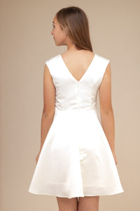 This is an all over satin, cap sleeve dress in ivory with non-stretch material, zipper back, and longer length detailing. This dress is perfect for any religious event like bat mitzvah, cotillion or church service. 
