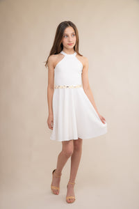 Halter dress in ivory features a full circle twirl skirt, open hole detailing in back and high waist line for a chic silhouette. Can be styled with a belt that is sold separately.