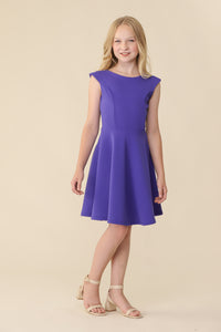 The cap sleeve textured fit and flare dress is shown in royal blue with high neck line, shoulder coverage and lower v-back detailing for a chic and sophisticated look. This dress can be worn to a more coservative special occasion event like cotillion, graduation, or religious service like a bat mitzvah service or church ceremony.
