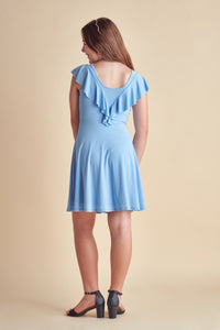 The back of the flutter sleeve dress in light blue with full circle skirt, flutter shoulder detailing and ruffle in back.