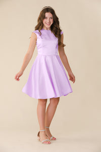 This is an all over satin, cap sleeve dress in lilac with non-stretch material, zipper back, and longer length detailing. This dress is perfect for any religious event like bat mitzvah, cotillion or church service. 