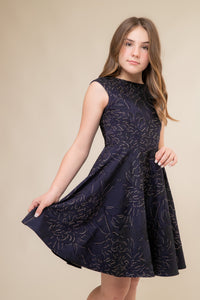 This is an all over jacquard, cap sleeve dress in navy floral with non-stretch material, zipper back, and longer length detailing. This dress is perfect for any religious event like bat mitzvah, cotillion or church service.