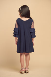 This is an all over stretch, navy tiered sleeve dress with mesh detailing on the sleeve. Hits above the knee for a beautiful and chic silhouette.