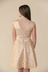 This is an all over jacquard, cap sleeve dress in rose gold with non-stretch material, zipper back, and longer length detailing. This dress is perfect for any religious event like bat mitzvah, cotillion or church service.