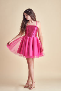This is sequin bodice dress in fuchsia pink with full tulle skirt with adjustable straps. Hits above the knee with zipper back detailing. This perfect bat mitzvah dress or party outfit for any girl.